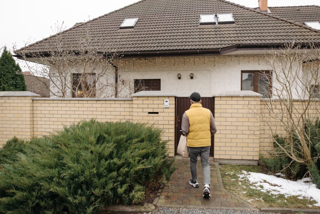 Deliveryman Walking Toward a House